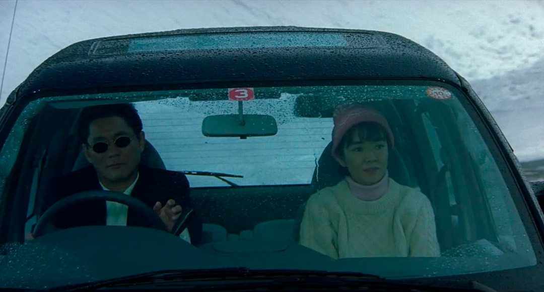 Takeshi Kitano, Kayoko Kishimoto dans Hana-bi