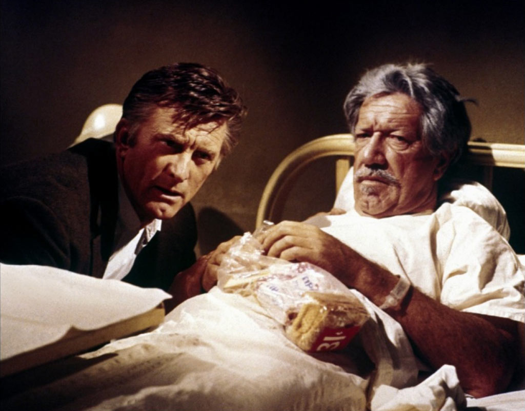 Kirk Douglas, Richard Boone dans L'Arrangement