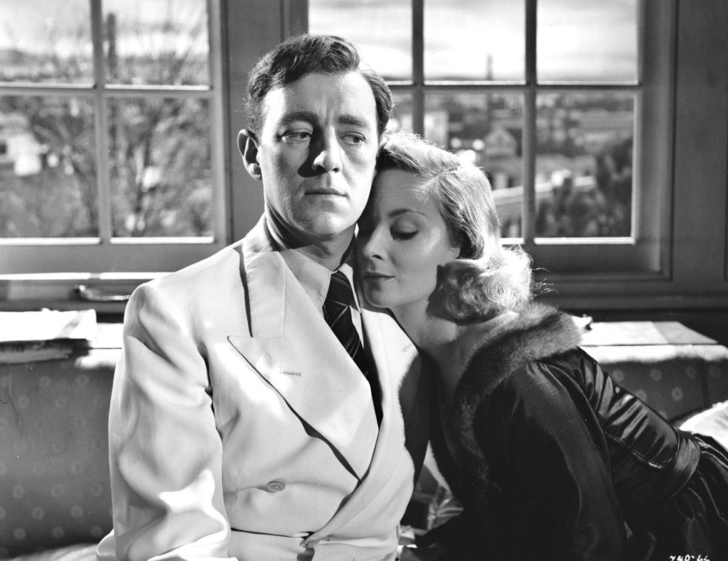 Alec Guinness, Joan Greenwood dans L'Homme au complet blanc