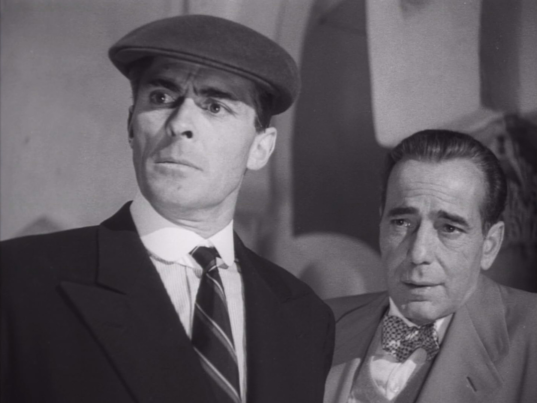 Humphrey Bogart, Edward Underdown dans Plus fort que le diable