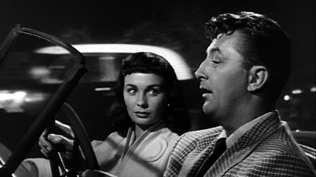 Robert Mitchum, Jean Simmons dans Un si doux visage